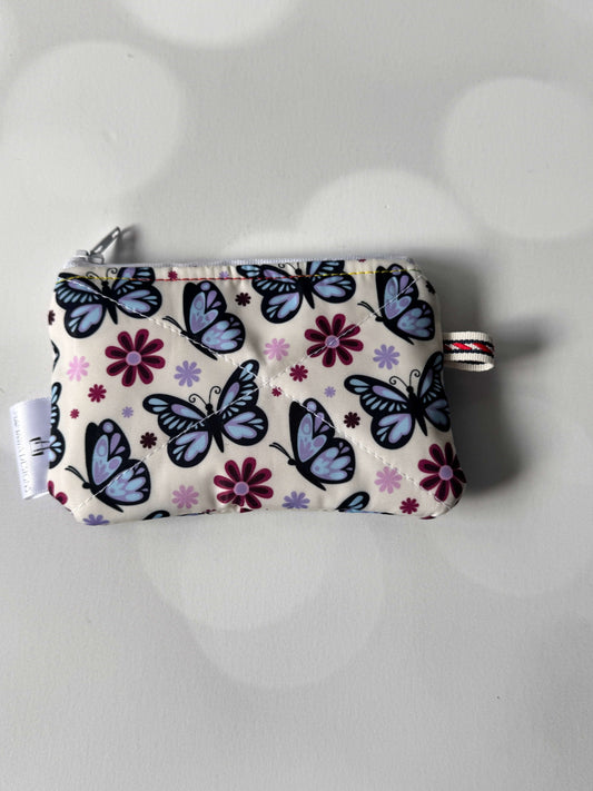Butterfly coin wallet with colorful butterfly and flower pattern, perfect for storing coins and small items.